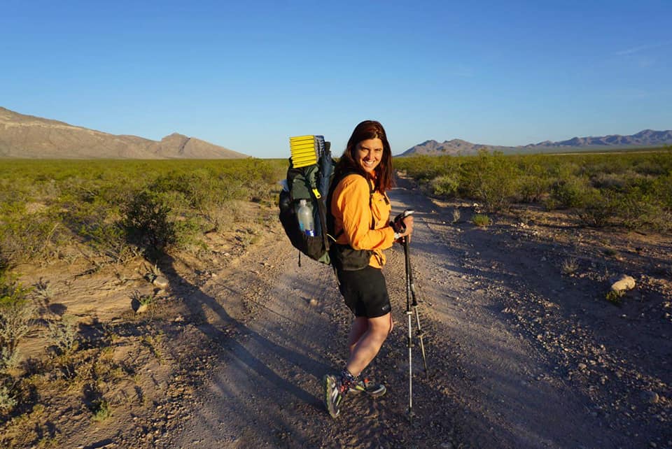 Image may contain: one or more people, people standing, tree, sky, shorts, outdoor and nature